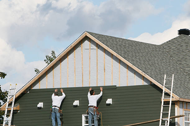 Professional Storm Damage Siding Repair technician working in Dover, KY